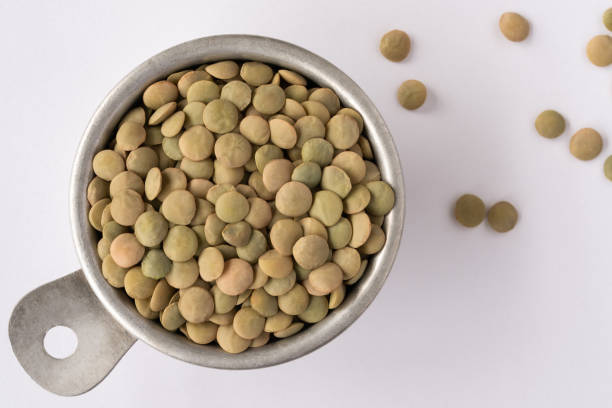 istock Uncooked Green Lentils in a Measuring Cup 1471309943