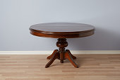 Brown antique table with round table top