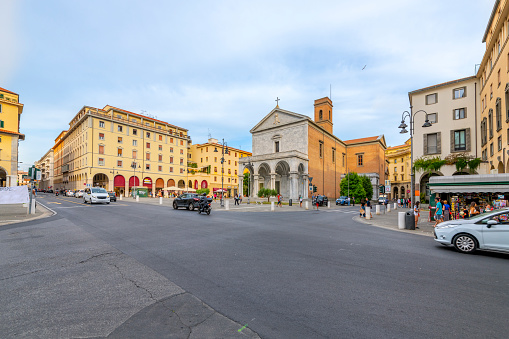 The Cathedral, or Cattedrale di San Francesco surrounded bay shops and cafes at Piazza Grande in the downtown district of Livoro, Italy.