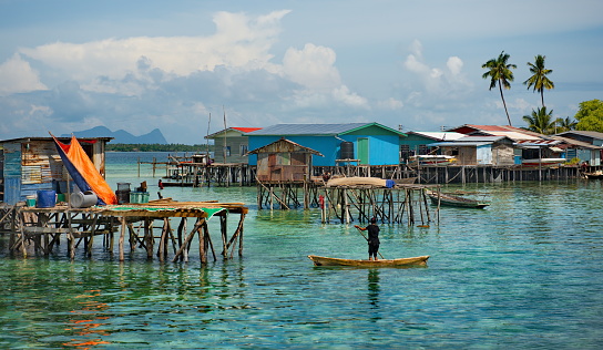 East Malaysia. Sea Gypsy village on a sandy coral reef island. The main trade of local residents is fishing and sea Souvenirs.