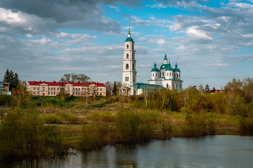 View of the Spassky Cathedral and the city of Yelabuga from the Toima River on a sunny spring day. Yelabuga, Tatarstan, Russia