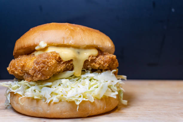 istock A hamburger with a fried chicken meat in between. 1471349793