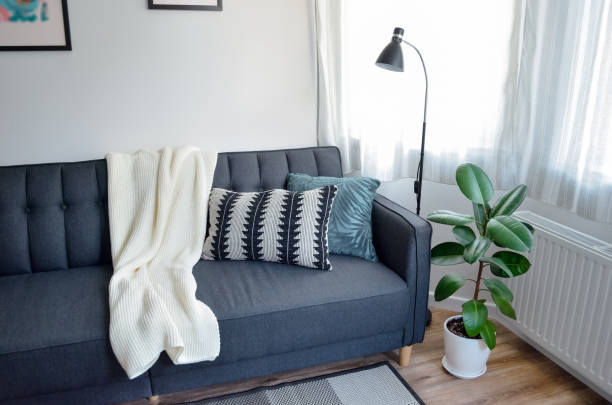 istock Scandinavian interior style modern studio small apartment in white and grey colors, sofa in living area 1471350813