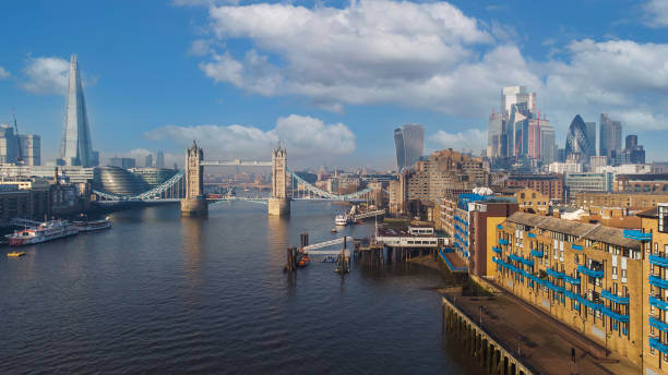 drone shot of tower bridge and london skyline - london england morning sunlight tower bridge imagens e fotografias de stock