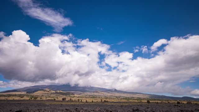 Timelapse - Beautiful clouds over the mountain range of volcanic landscape
