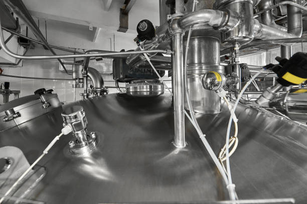 istock Pipes with flanges on cistern for fermented milk products 1471355341
