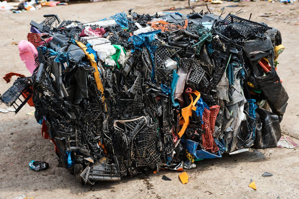 istock Pack of plastic materials in recycling plant yard closeup 1471355346