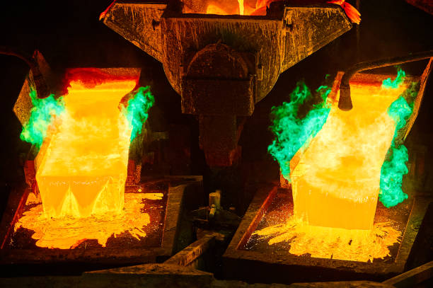 istock Pouring molten copper for anodes into form on casting wheel 1471355497