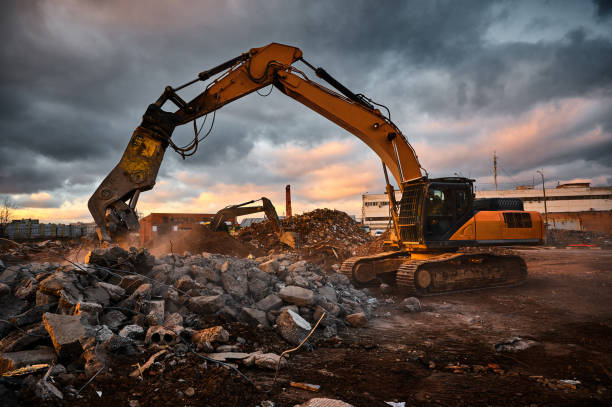 istock Modern crusher on excavator rigging dismantles concrete beam 1471355526
