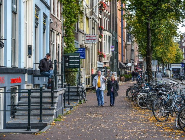 Amsterdam, Holland - Oct 7, 2018. Cityscape of Amsterdam with famous architectural landmarks and busy traffic on roads.