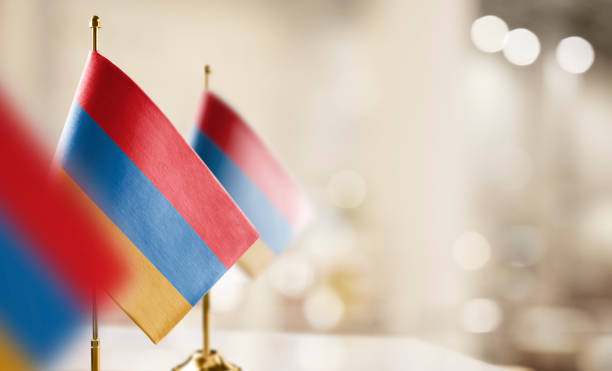 istock Small flags of the Armenia on an abstract blurry background 1471356861