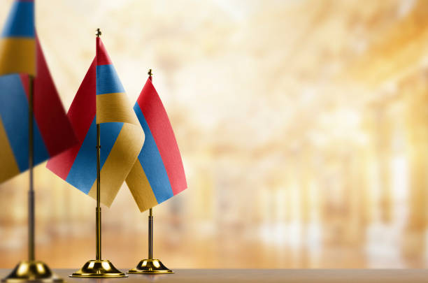 istock Small flags of the Armenia on an abstract blurry background 1471356875