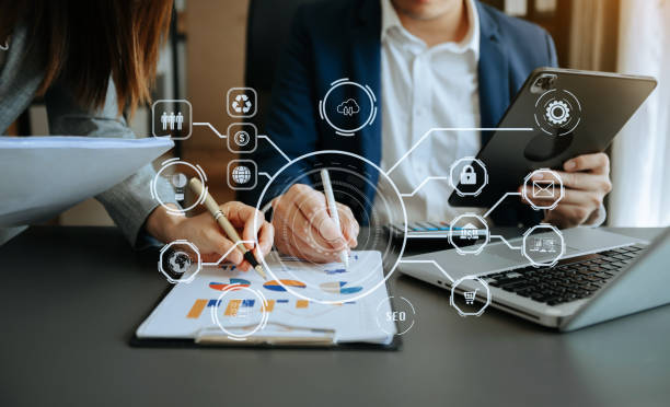 istock Working team meeting concept, business using laptop and smart phone and digital tablet computer with digital marketing media  in virtual icon network diagram office 1471363364