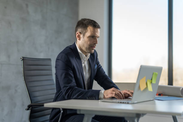 istock Businessman working online on laptop in the office. 1471365310