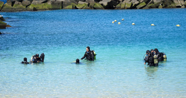 Mid-adult black woman in a scuba diving gear in the Atlantic ocean in Miami, Florida in USA.