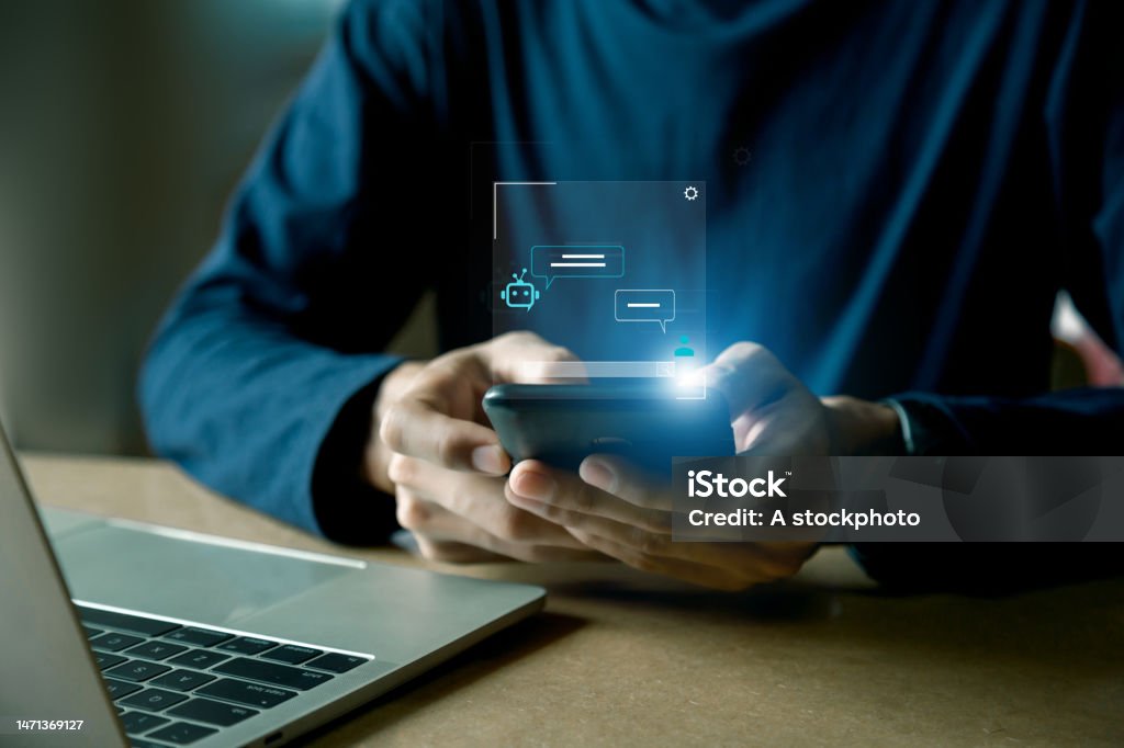 Chatbot Chat with AI, Artificial Intelligence. man using technology smart robot AI , Futuristic technology transformation , robot application, conversation assistant concept. Analyzing Stock Photo