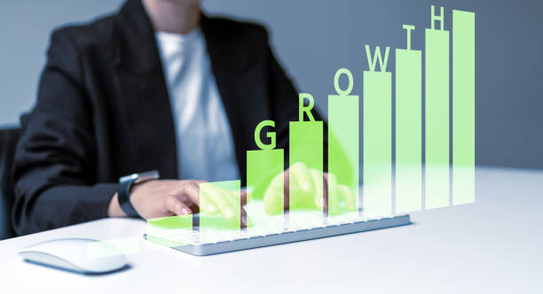 istock Green chart with word Growth and Business person using computer keyboard . 1471371242