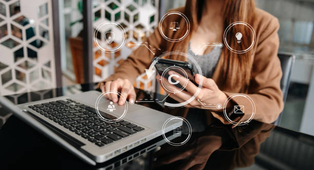 istock Copyright or patent concept, Person hand using laptop computer, tablet and smartphone with virtual screen copyright icon trademark, Creation ownership against piracy. at office 1471372208