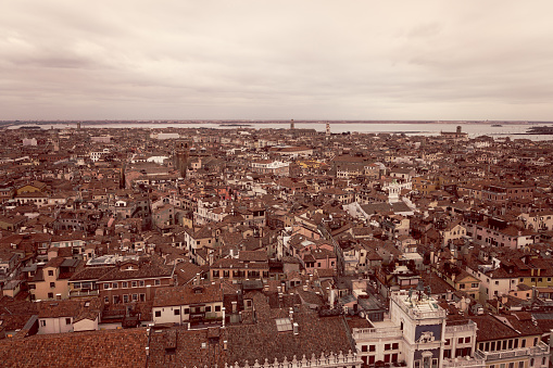 Vintage style photo of the Venice center with chaotic medieval buildings, Aerial view from the bell tower (Campanile di San Marco)