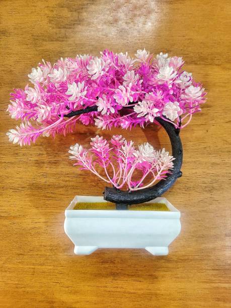 istock An artificial pink bonsai against wooden table 1471378455