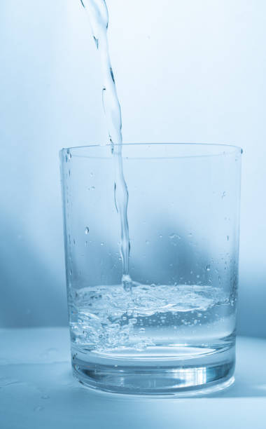 istock pour water into a glass 1471381582