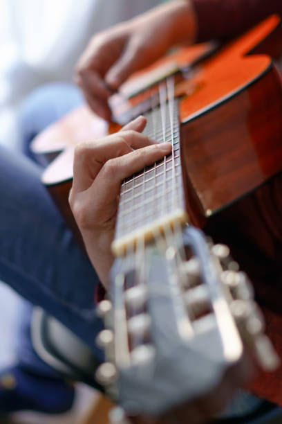 istock man's hands playing the Spanish guitar 1471383104