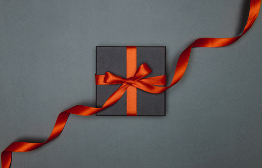 Gift box on gray color, directly above.