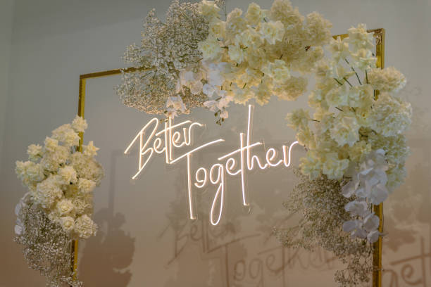istock Better together text on photo-wall. Arch decorated flowers, greenery. Wedding reception. Celebration concept. Decorations in luxury ceremony in hall restaurant. Trendy decor for party in banquet area. 1471386731