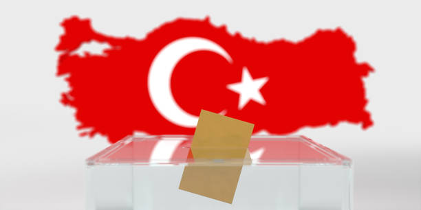 Vote envelop in ballot box on Turkish flag background stock photo