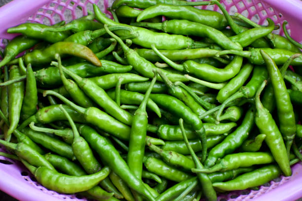 istock Fresh Green chilli pepper in basket plugged from the garden 1471390662