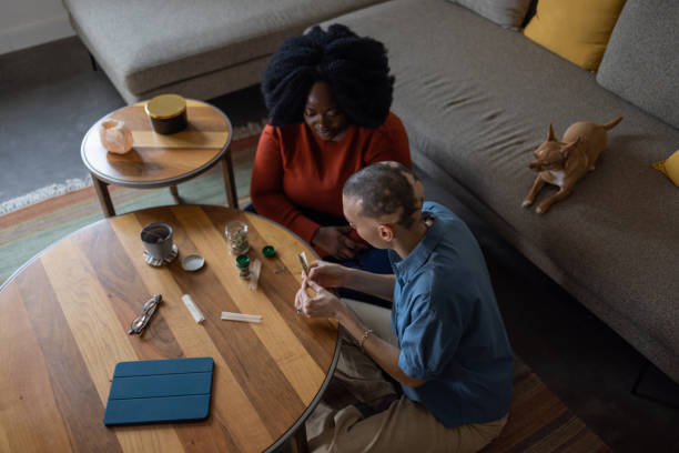 istock friends having a great time smoking cannabis at home 1471394263