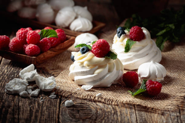 istock Dessert Pavlova with raspberries, blueberries and mint. 1471395591