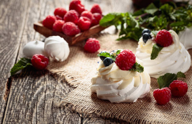 istock Dessert Pavlova with raspberries, blueberries and mint. 1471395608