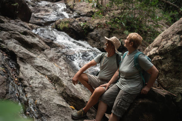 istock Senior hikers enjoying the river view 1471396113
