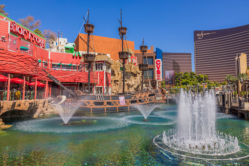 Las Vegas. USA. 09.17.2022. Beautiful view of artificial pond with pirate ship and fountains Treasure Island hotel in Las Vegas on the Strip.