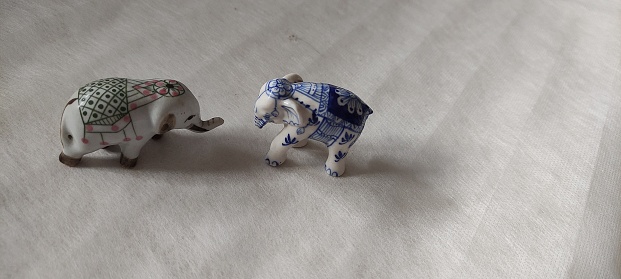 ceramic small elephant patterned on white background