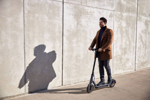 istock Man commute to work on electric scooter. E-mobility concpet 1471408990