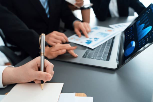 istock Closeup to view hand using laptop to analyze financial data in harmony office. 1471409465