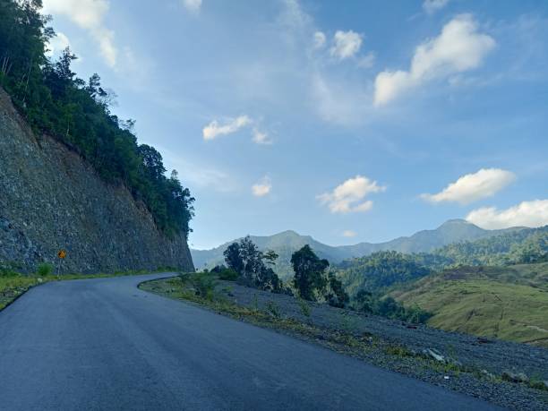 istock Road Leading To A Hill 1471416221
