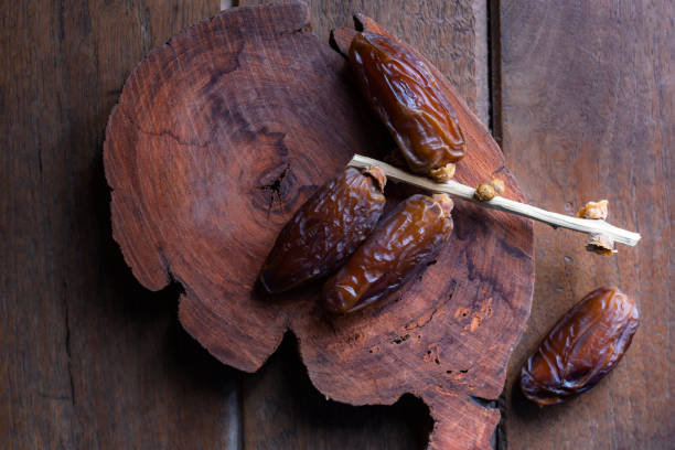 istock Healthy food date fruit on wood table. 1471416542