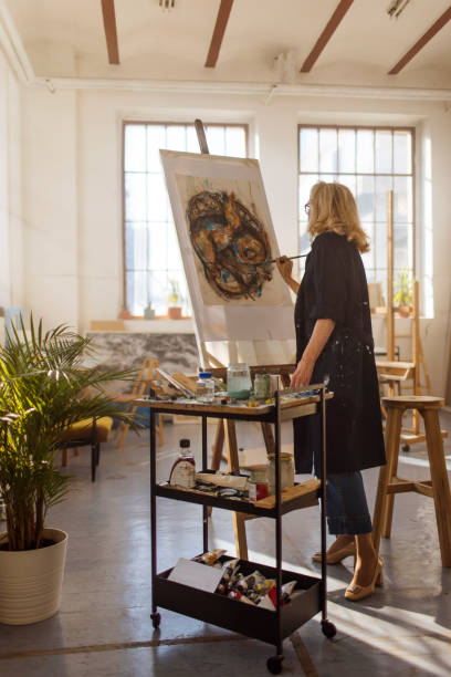 istock Artist woman in an art studio 1471420820