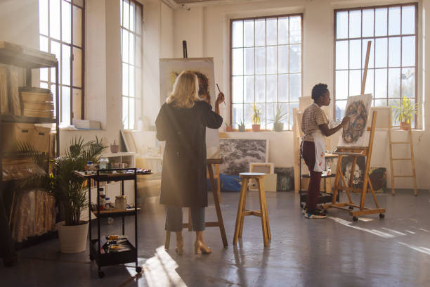 Painting together Two women are painting together at the art studio fine art image pictures stock pictures, royalty-free photos & images