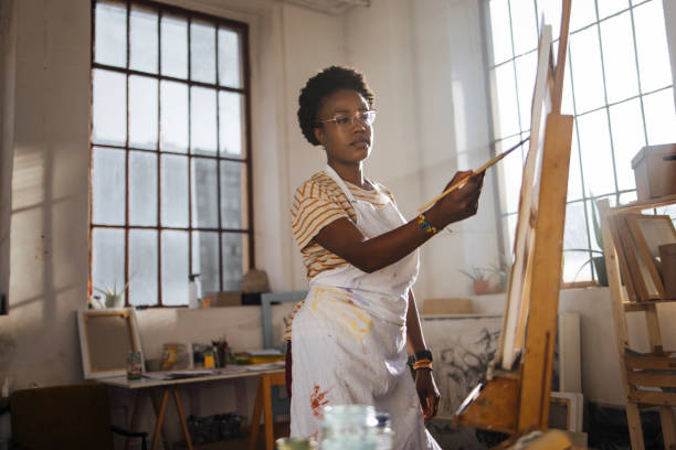 Girl painting on canvas