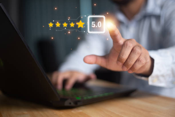 istock User give rating to service experience on online application for Customer review satisfaction feedback survey concept. 1471421232