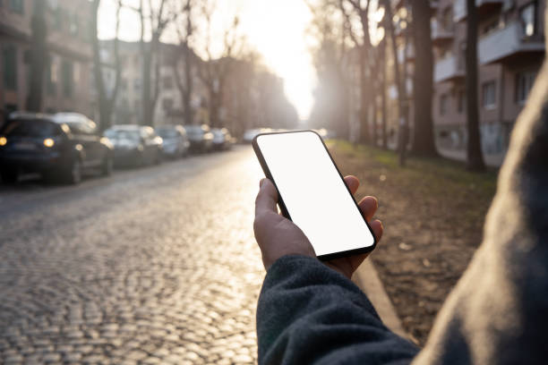 istock Cellphone with touch screen in male hand in city. 1471421649