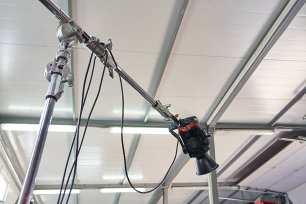 lighting monoblock mounted on a seat under the ceiling of a film studio