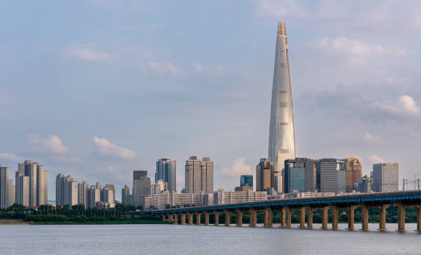 Lotte World Tower skyscraper and Han River in Seoul South Korea Lotte World Tower skyscraper and Han River in Seoul South Korea on 5 August 2022 kangnamgu stock pictures, royalty-free photos & images