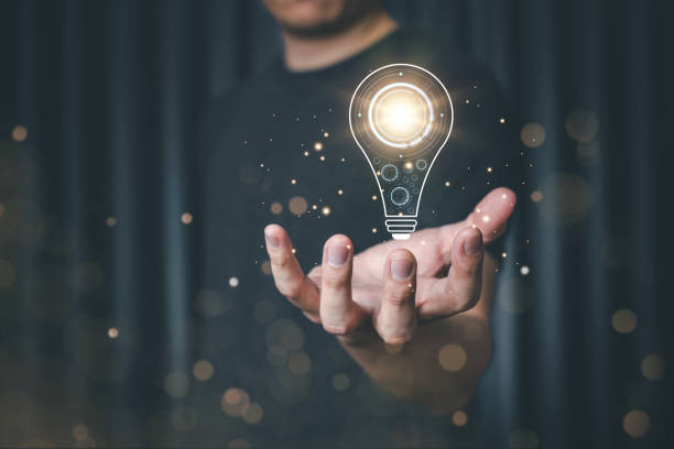 istock Male hand holding light bulb for new idea concept with innovation and technology inspiration, innovation in science and research concept start up, Innovation. 1471423521