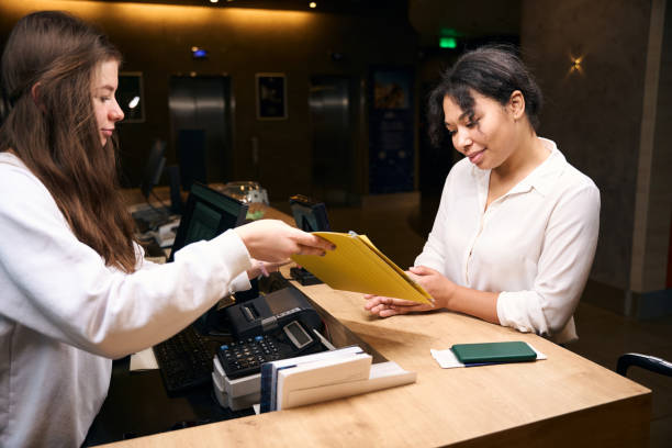 istock Elegant African American lady checking into hotel 1471423673