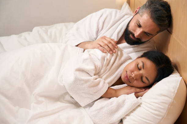 istock Romantic man and his girlfriend in hotel room 1471423864